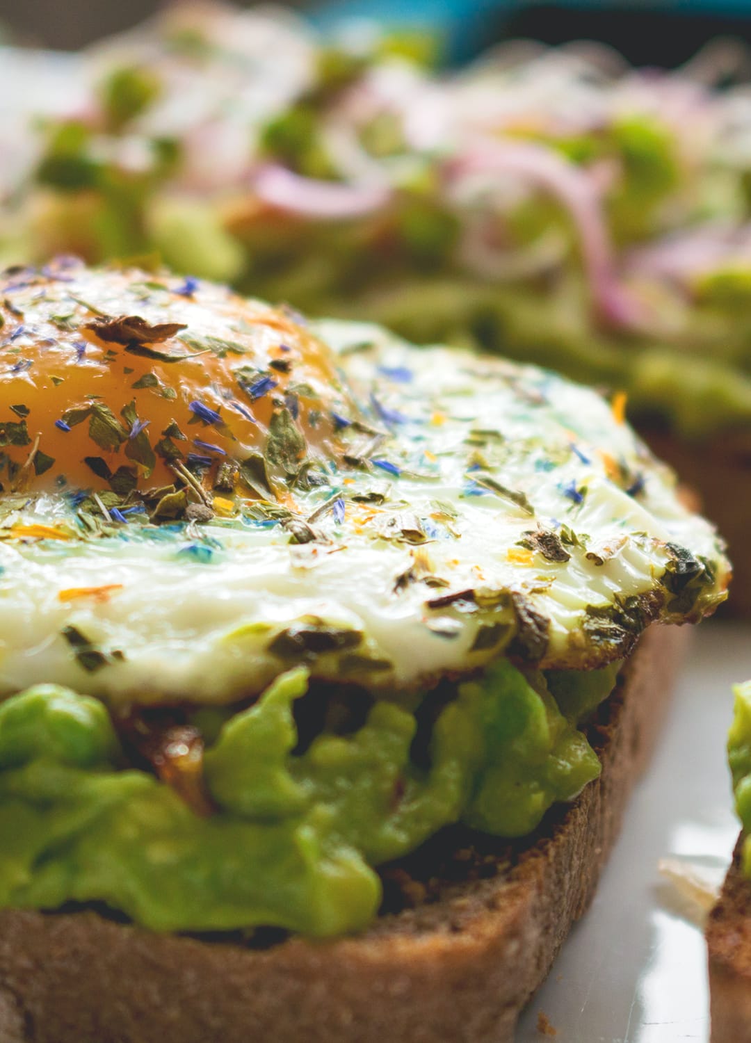 Avocado Toast - 4 ways! With sauted mushrooms, with feta and toasted pine nuts, with guacamole and sprouts, and with a sunny side up egg. Delicious, easy, and healthy breakfast! I love these recipes. | thehealthfulideas.com