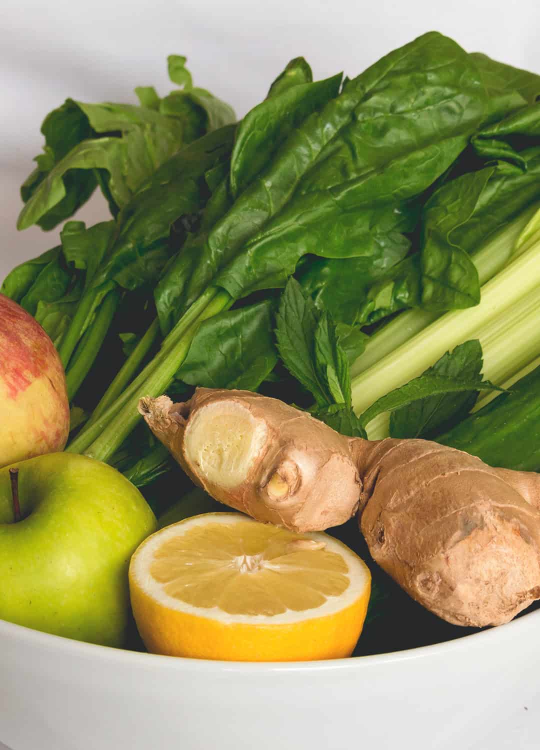 Green Juice with Ginger - delicious alkalizing green juice with ginger and lemon. Full of amazing vitamins and minerals your body craves! One green juice a day keeps the doctor away. I love this recipe! | thehealthfulideas.com