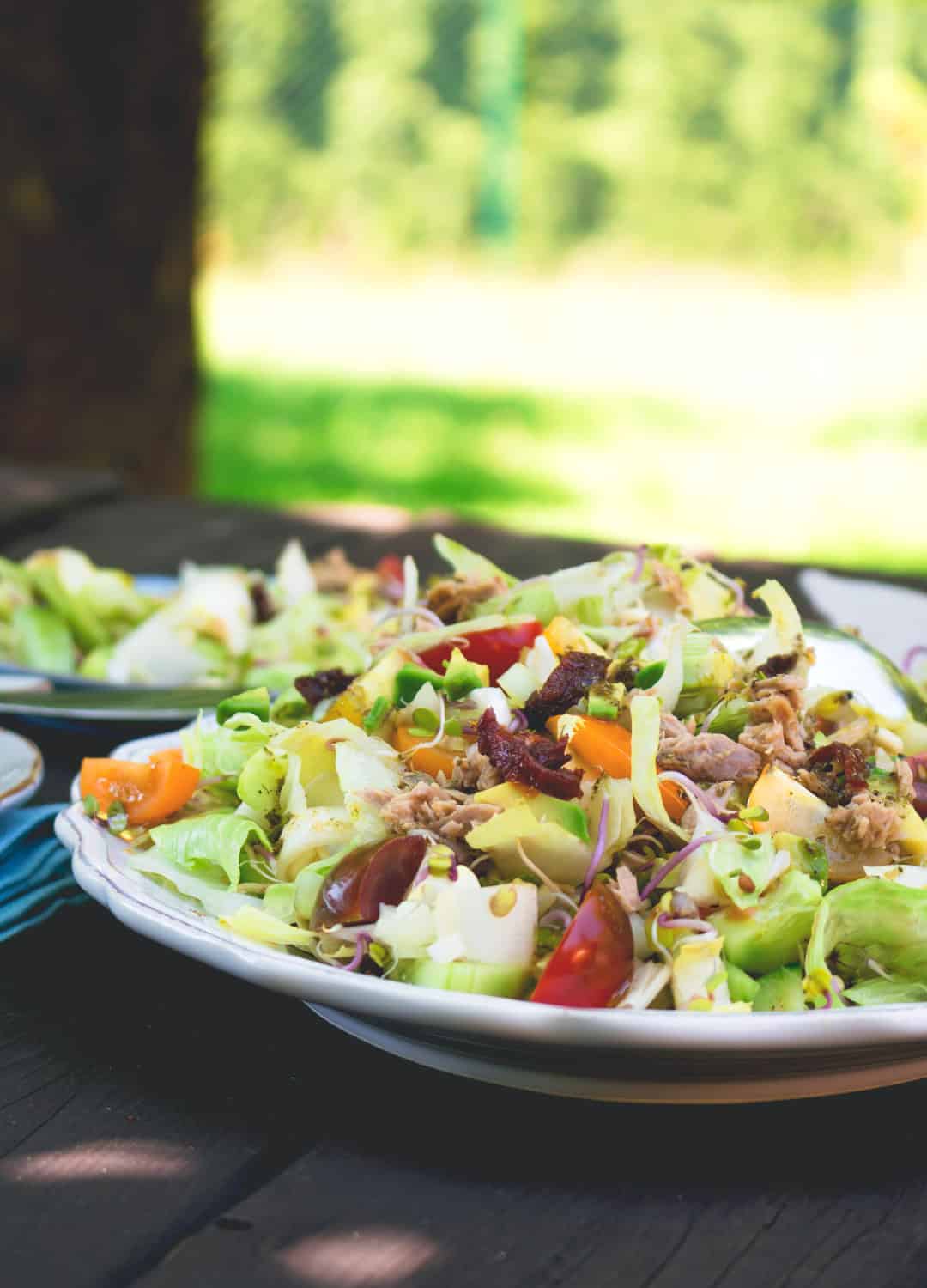 Colorful Salad with Tuna and Sundried Tomatoes - delicious easy every day summer lunch. A few ingredients include lettuce, cherry tomatoes, cucumber, avocado, and dressing. Great as packed lunch! | thehealthfulideas.com