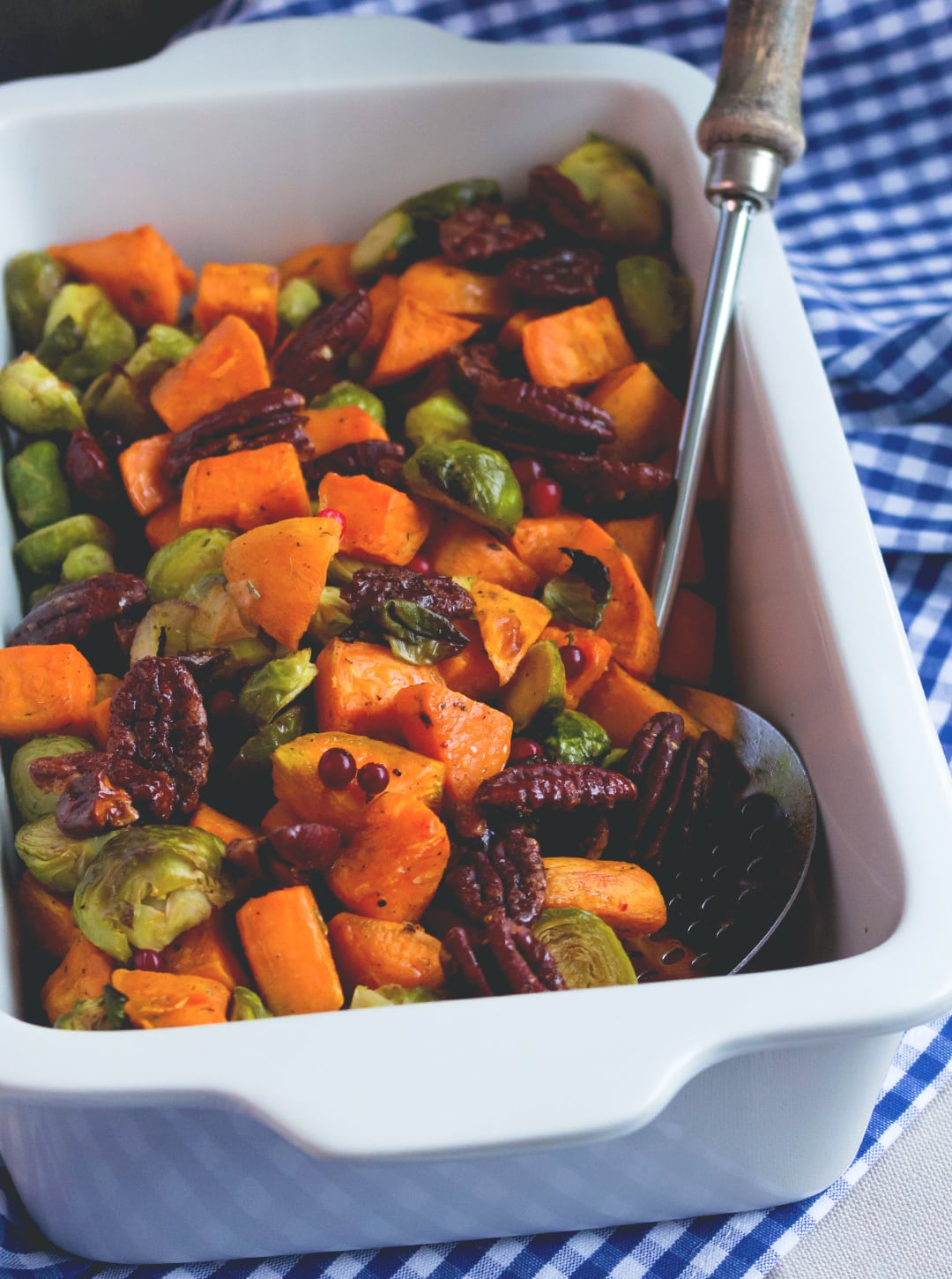 Roasted Sweet Potatoes and Brussels Sprouts with Maple Drizzle - delicious side dish, great all year round! I absolutely love this recipe. It's sweet, savory, tangy, nutty, hearty, and vegan and healthy! | thehealthfulideas.com