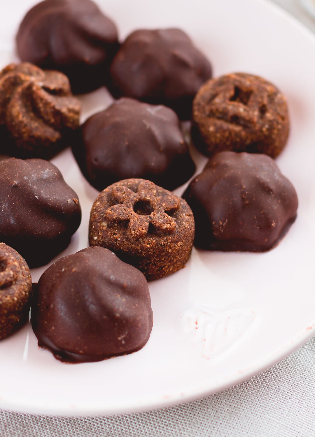Raw Chocolate Covered Cookies - vegan and delicious, these chocolatey cookies are actually healthy! Great for Valentine's Day or any other day of the week when you're craving something sweet! Store them in the fridge or in the freezer. | thehealthfulideas.com