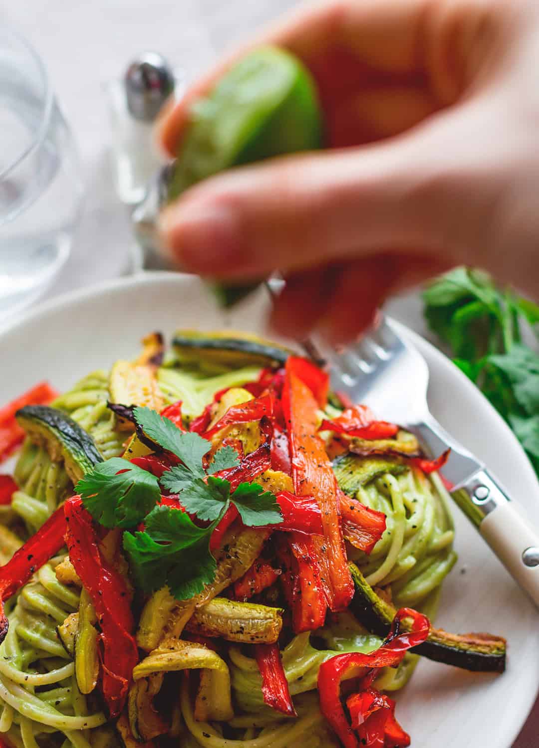 Brown Rice Pasta with Creamy Cilantro Sauce - I absolutely LOVE this recipe! Gluten-free, vegan, and totally scrumptious! The Creamy CIlantro Sauce isn't only great as a pasta sauce. You can thin it out and use it as salad dressing or use it as dip! | thehealthfulideas.com