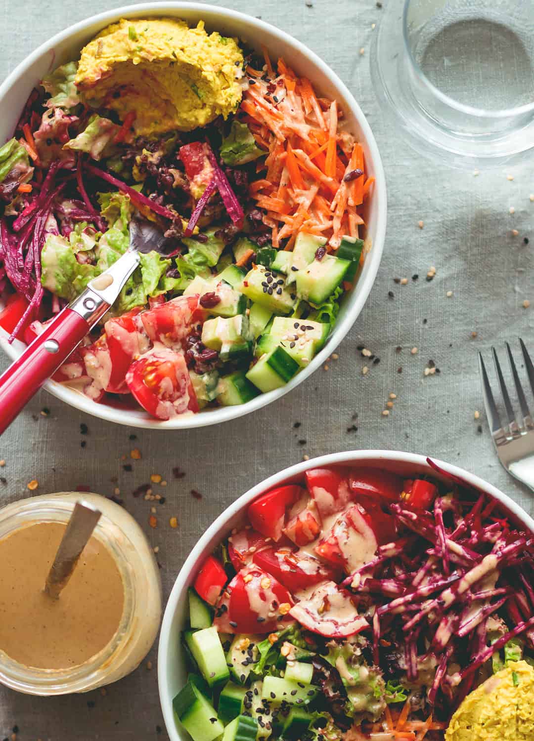 Black Rice Salad Bowl with Tahini Dressing - easy to make fresh summer salad. I love to make this ahead for busy work days! Tomatoes, cucumber, beets, carrots, hummus, lettuce, black rice, and tahini dressing. (vegan, GF) | thehealthfulideas.com