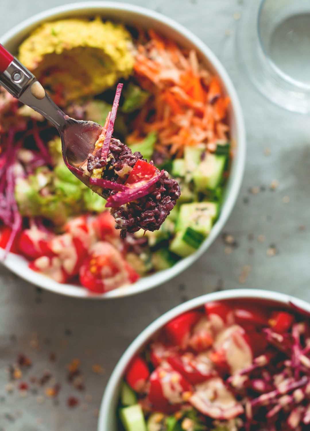 Black Rice Salad Bowl with Tahini Dressing - easy to make fresh summer salad. I love to make this ahead for busy work days! Tomatoes, cucumber, beets, carrots, hummus, lettuce, black rice, and tahini dressing. (vegan, GF) | thehealthfulideas.com