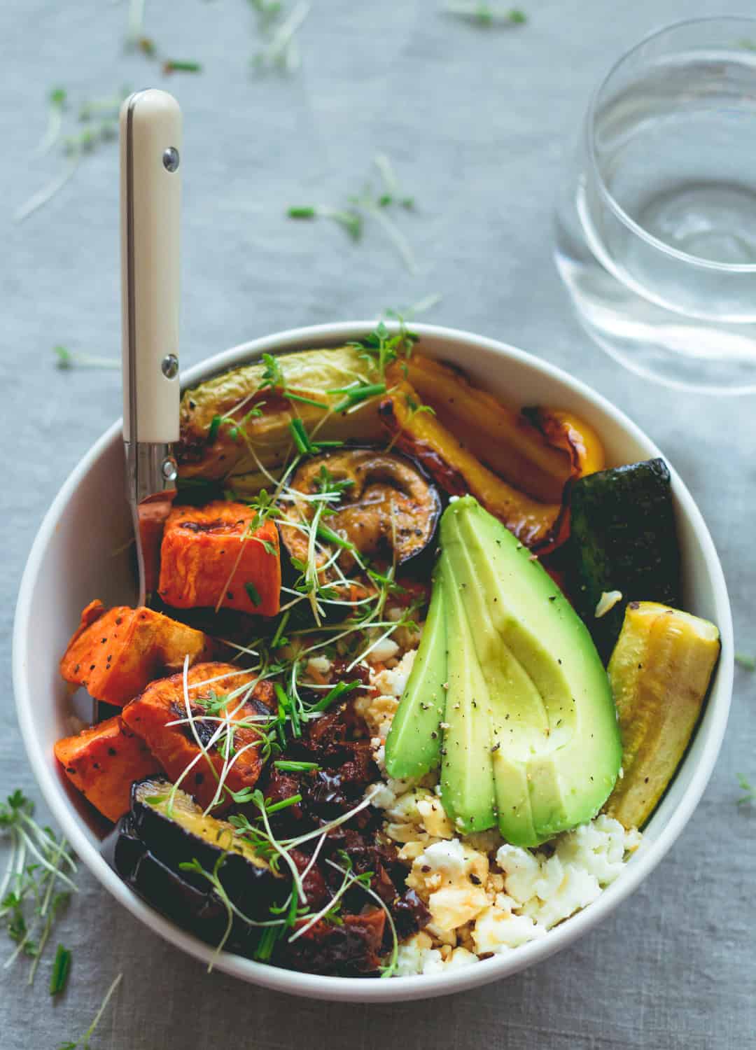 Brown Rice Salad Bowl with Roasted Veggies & Tamari Dressing - not your average boring salad! Roasted veggies, sweet potatoes, brown rice, lettuce, sundried tomatoes, goats cheese, and avocado with sweet & sour tamari dressing. Easy to make and absolutely scrumptious! | thehealthfulideas.com