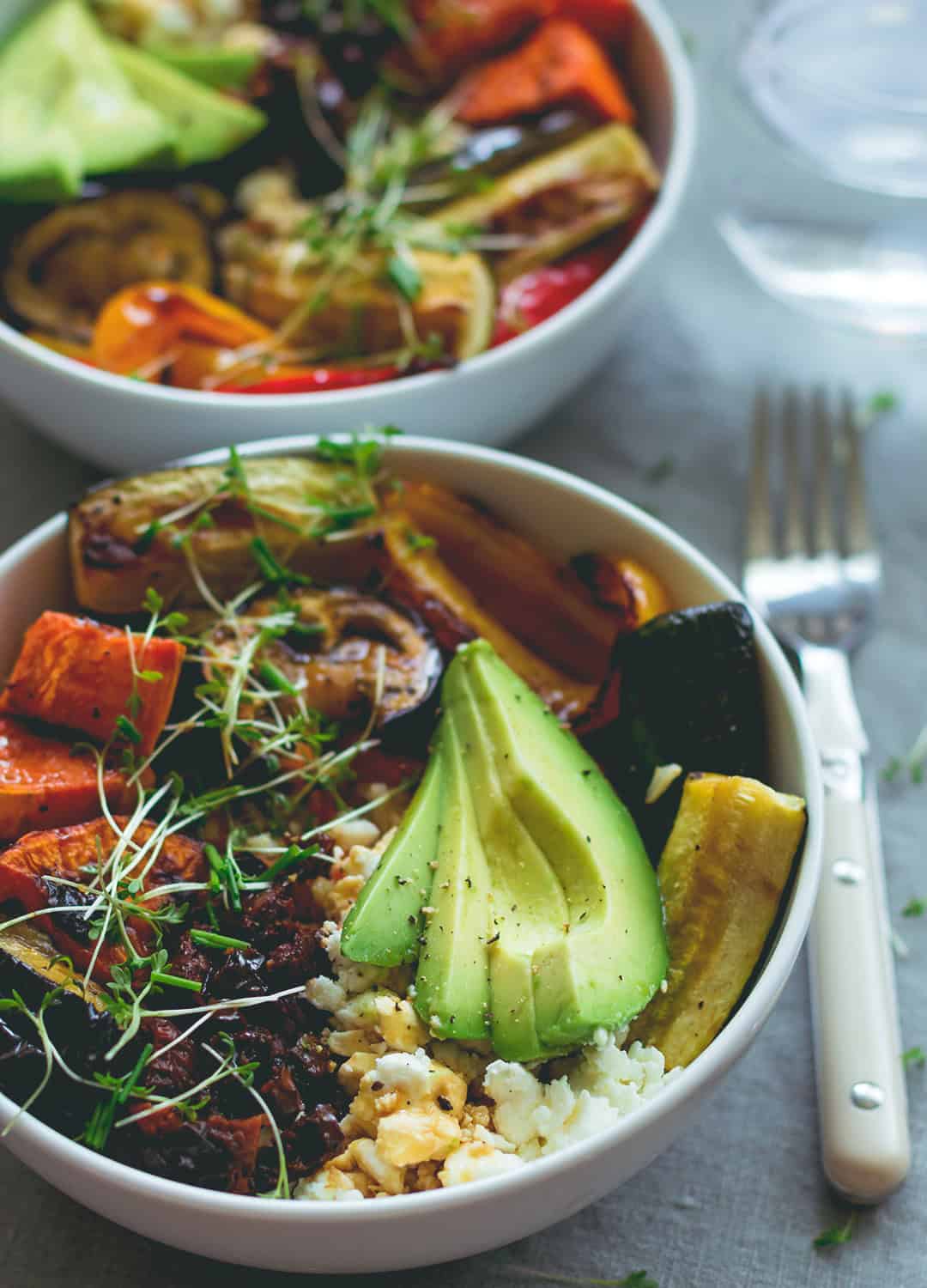 Brown Rice Salad Bowl with Roasted Veggies & Tamari Dressing - not your average boring salad! Roasted veggies, sweet potatoes, brown rice, lettuce, sundried tomatoes, goats cheese, and avocado with sweet & sour tamari dressing. Easy to make and absolutely scrumptious! | thehealthfulideas.com