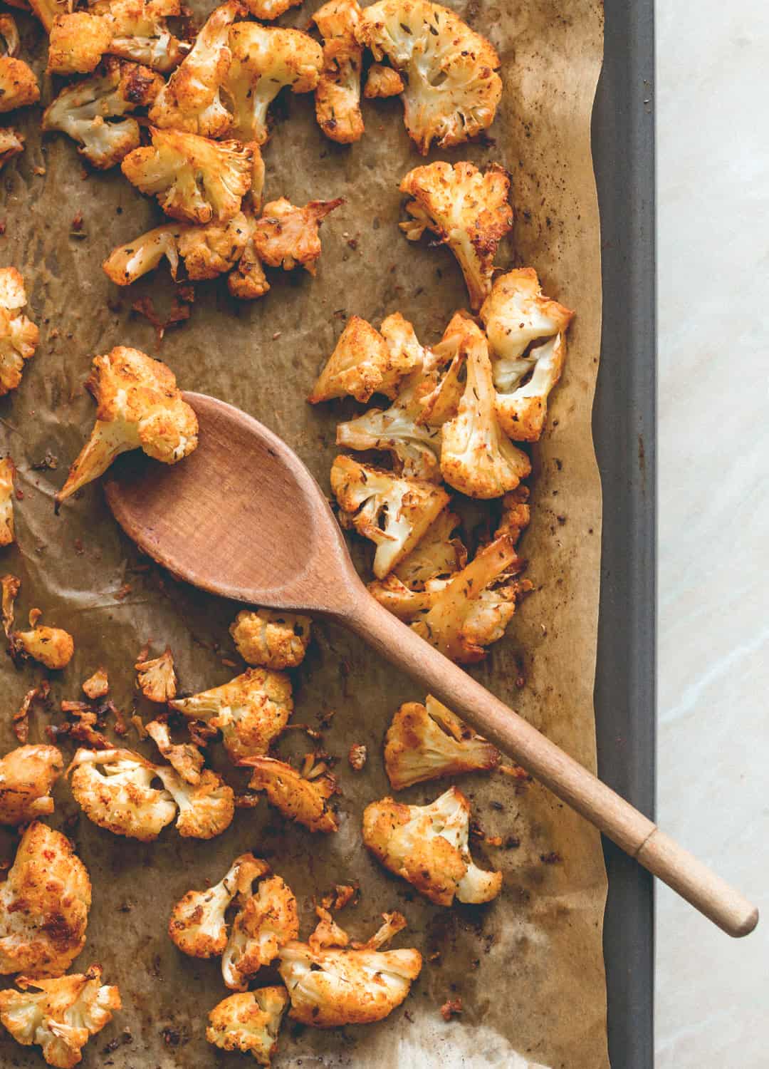 Cajun Roasted Cauliflower Salad - I love cajun seasoning on roasted fall vegetables. This salad is perfect for this time of the year. Cauliflower, mixed salad, and tahini dressing. (vegan, GF) | thehealthfulideas.com