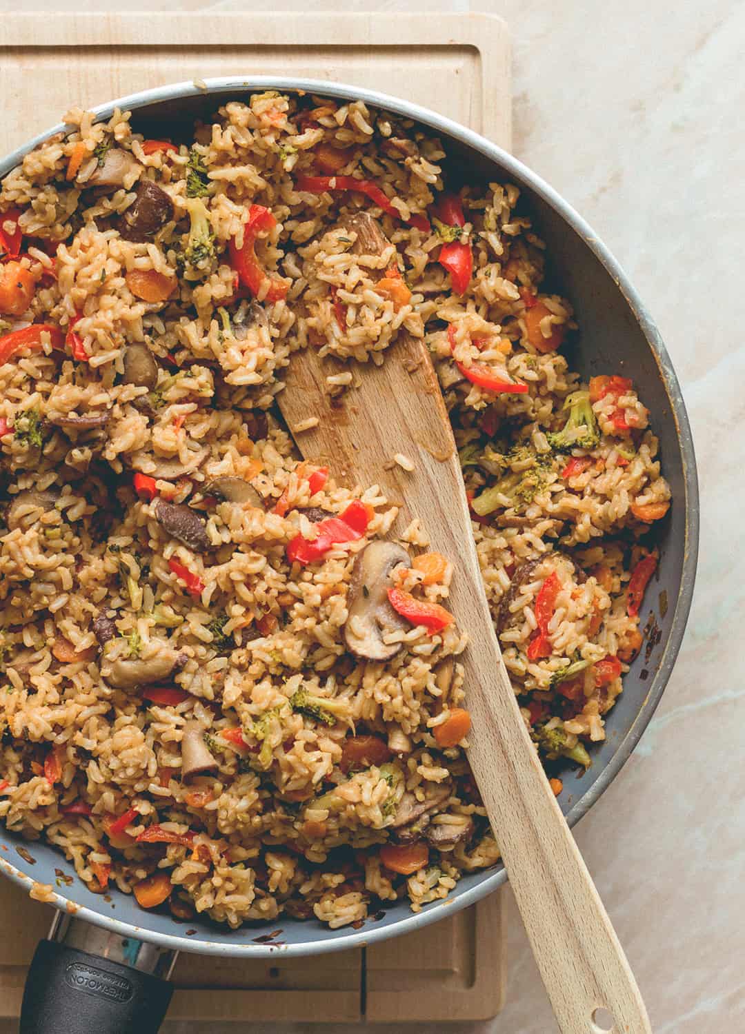 Loaded Veggie Fried Rice - the most comforting, filling, hearty recipe. Made with brown rice, mushrooms, veggies, spices, and tamari almond butter dressing. (vegan, GF) | thehealthfulideas.com