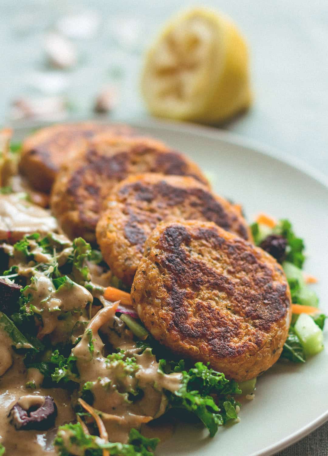 Sweet Potato Quinoa Patties with mixed salad and tahini dressing. This recipe is vegan, gluten-free, and totally amazing! You'll love it. | thehealthfulideas.com