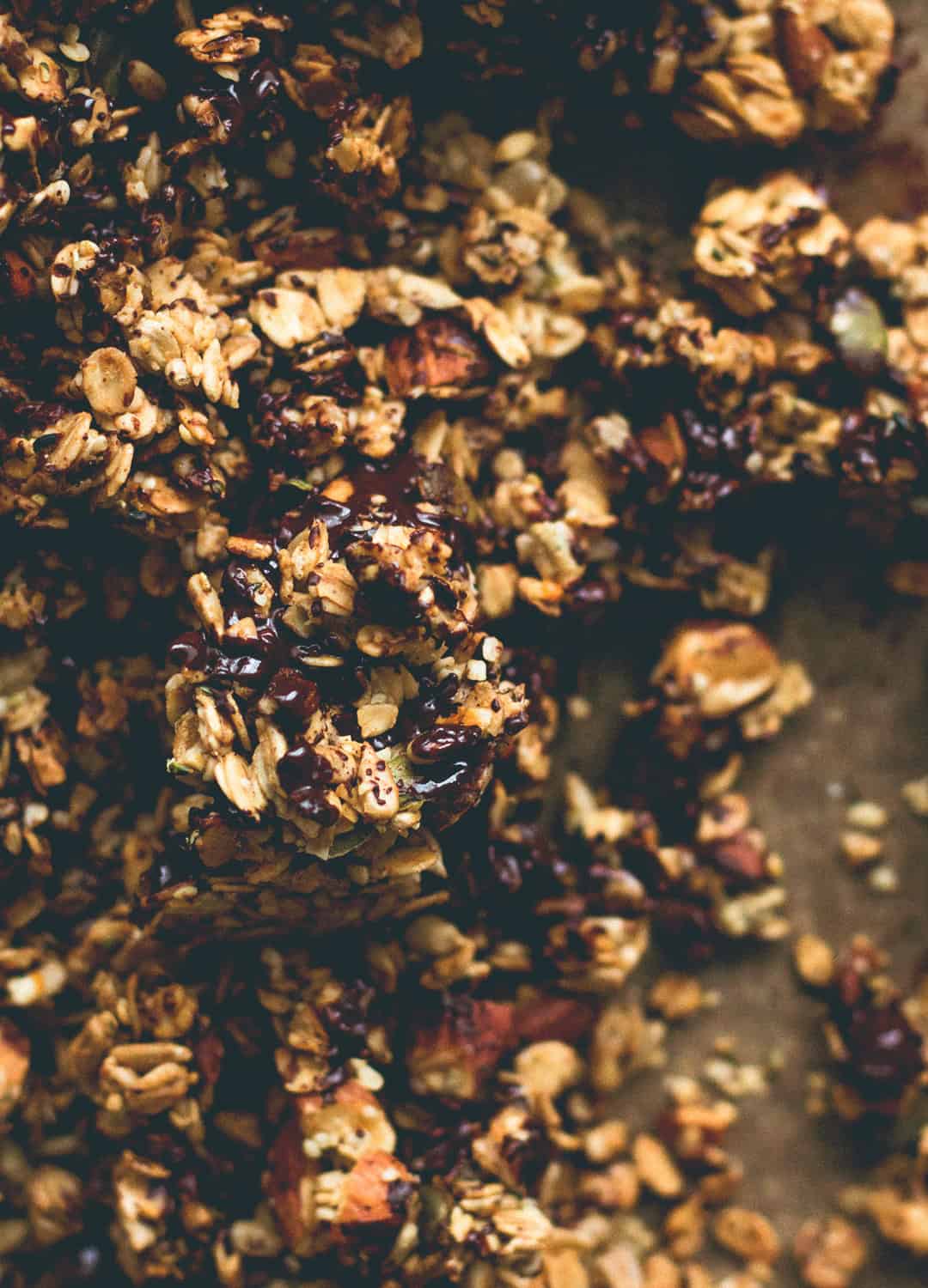 Orange Zest Granola with Dark Chocolate - delicious sweet zesty granola with melted cacao paste on top to create the best dark chocolate & orange flavor. Gluten-free, vegan, and sugar-free! You'll LOVE this granola! | thehealthfulideas.com