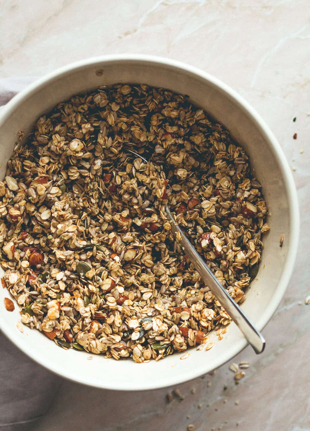 Orange Zest Granola with Dark Chocolate - delicious sweet zesty granola with melted cacao paste on top to create the best dark chocolate & orange flavor. Gluten-free, vegan, and sugar-free! You'll LOVE this granola! | thehealthfulideas.com