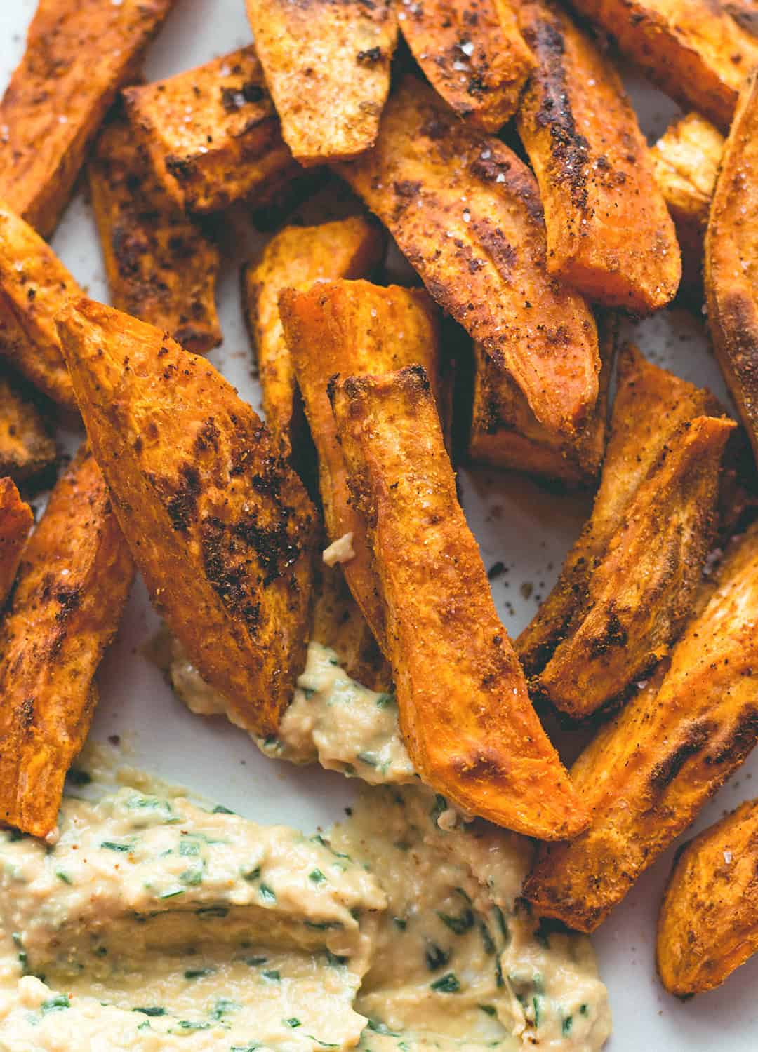 Tandoori Masala Sweet Potato Wedges (vegan, GF) - over roasted sweet potato fries with amazing spices, and a touch of coconut oil. Easy to make, delicious, and totally guilt-free. You'll love this recipe! | thehealthfulideas.com