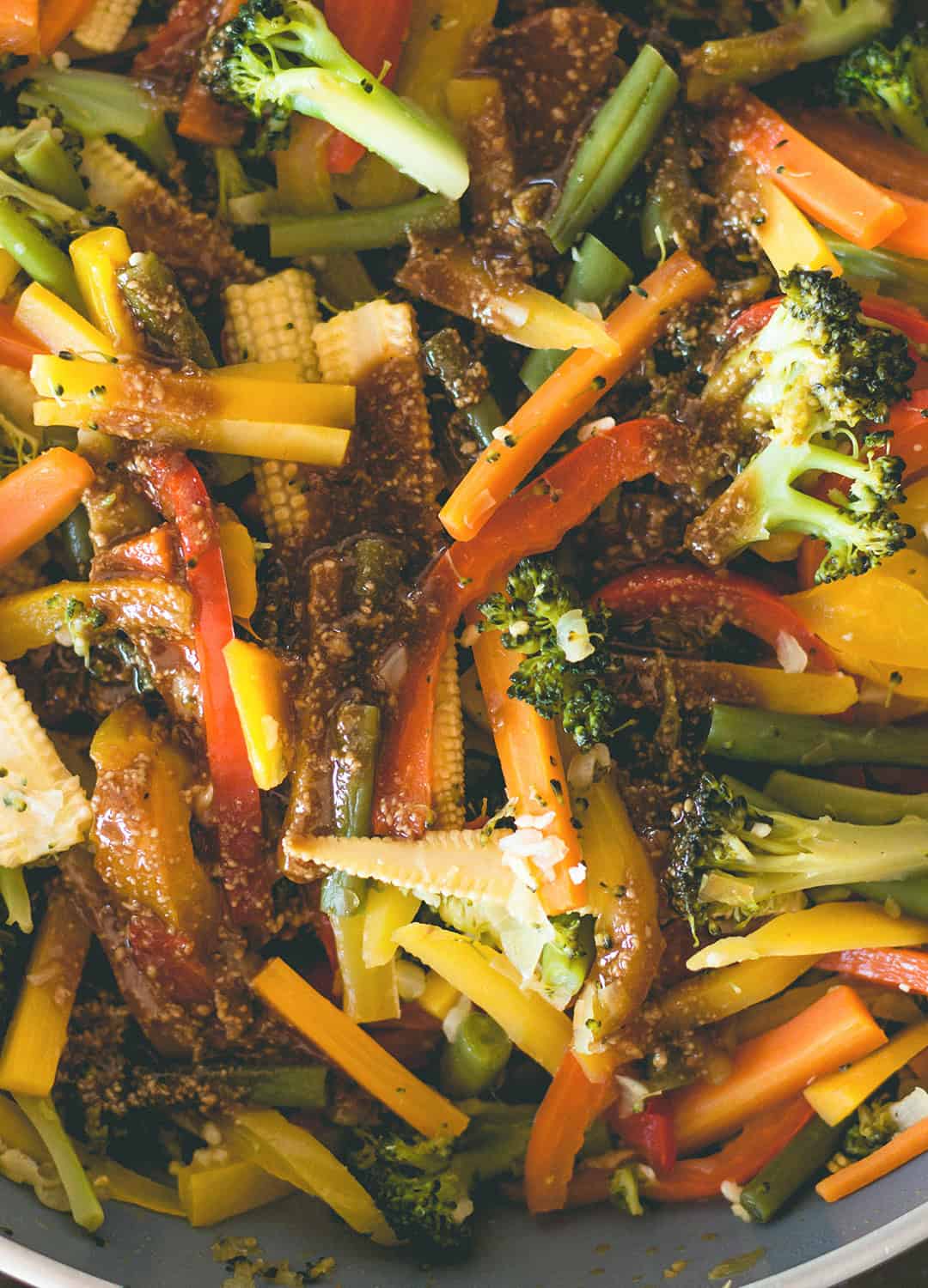 Vegetable Stir Fry with Rice Noodles and Sunflower Seed Sauce - delicious vegan stir fry with peanut-free sauce made with tamari, sunflower seed butter, maple syrup, sesame oil, and ACV. You'll love this recipe! | thehealthfulideas.com