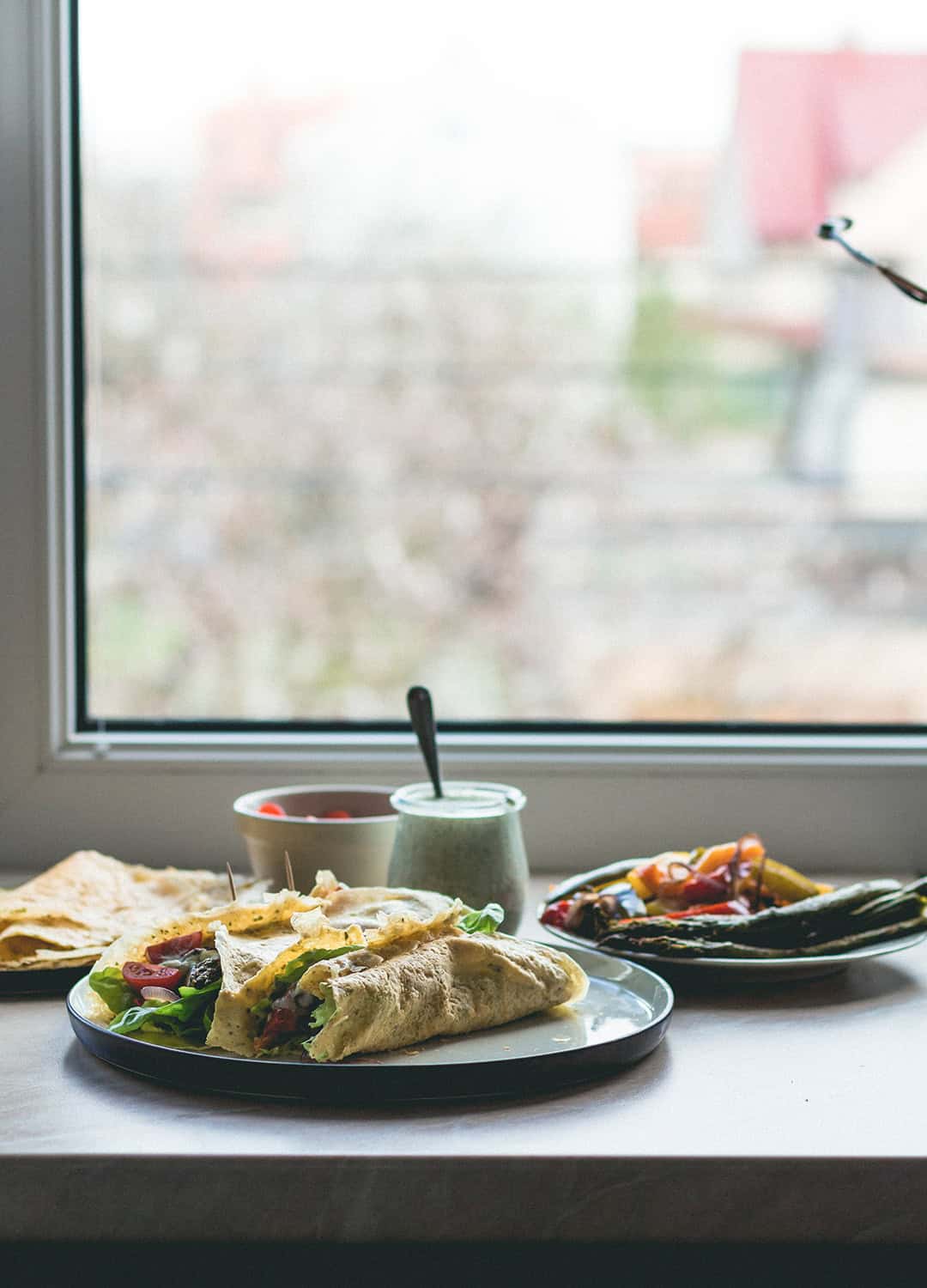 Chickpea Flour Crepes with Roasted Vegetables, fresh vegetables, and homemade sheep tzaziki! With a vegan option too! | thehealthfulideas.com