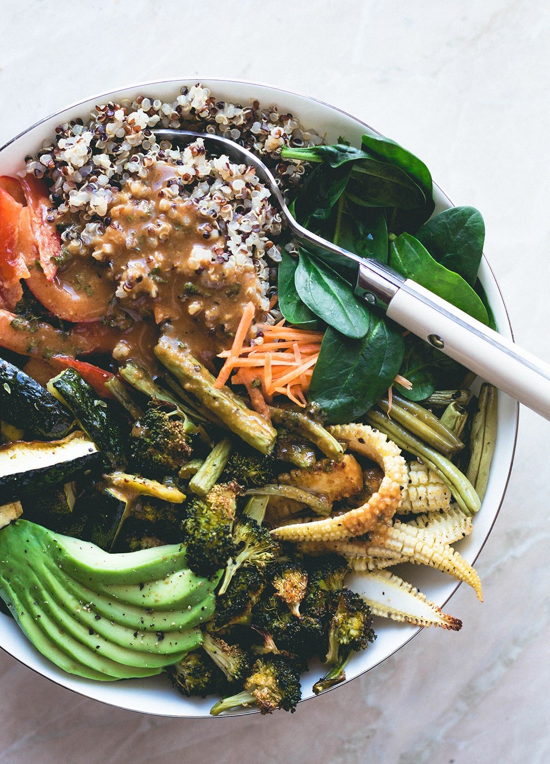 Thai Power Bowl with Wild Peanut Butter Dressing (vegan-gluten-free) - delicious salad bowl with colorful quinoa, roasted vegetables, spinach, avocado, carrots, bell peppers, and the most amazing dressing! | thehealthfulideas.com