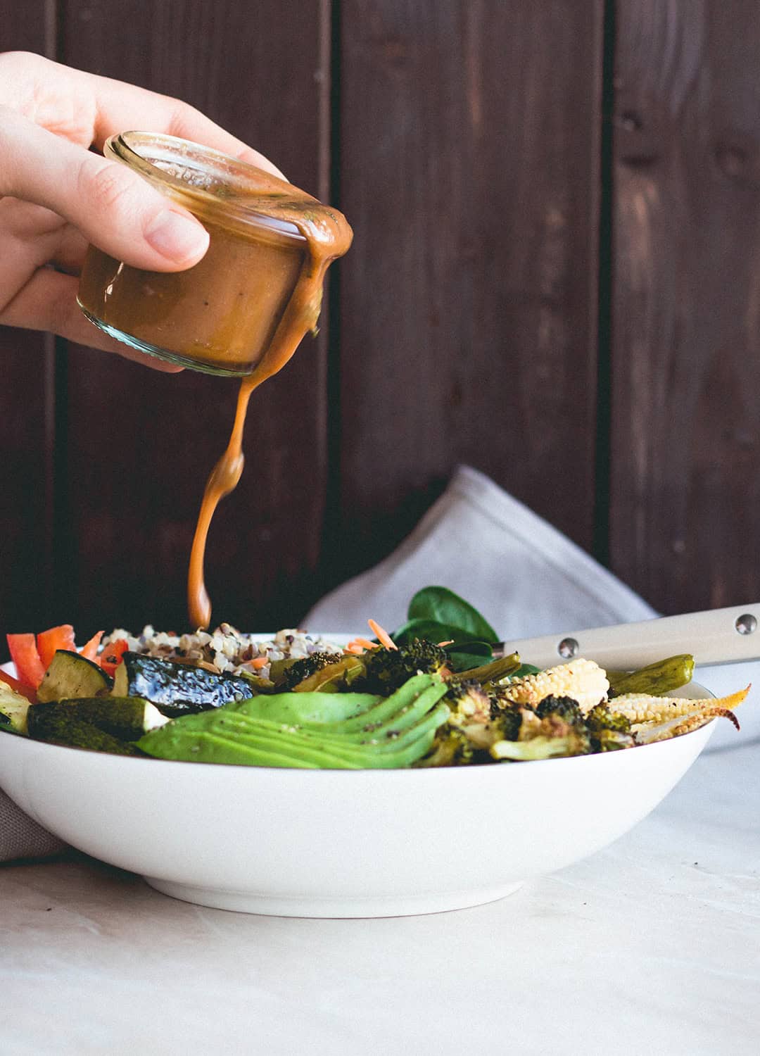 Thai Power Bowl with Wild Peanut Butter Dressing (vegan-gluten-free) - delicious salad bowl with colorful quinoa, roasted vegetables, spinach, avocado, carrots, bell peppers, and the most amazing dressing! | thehealthfulideas.com