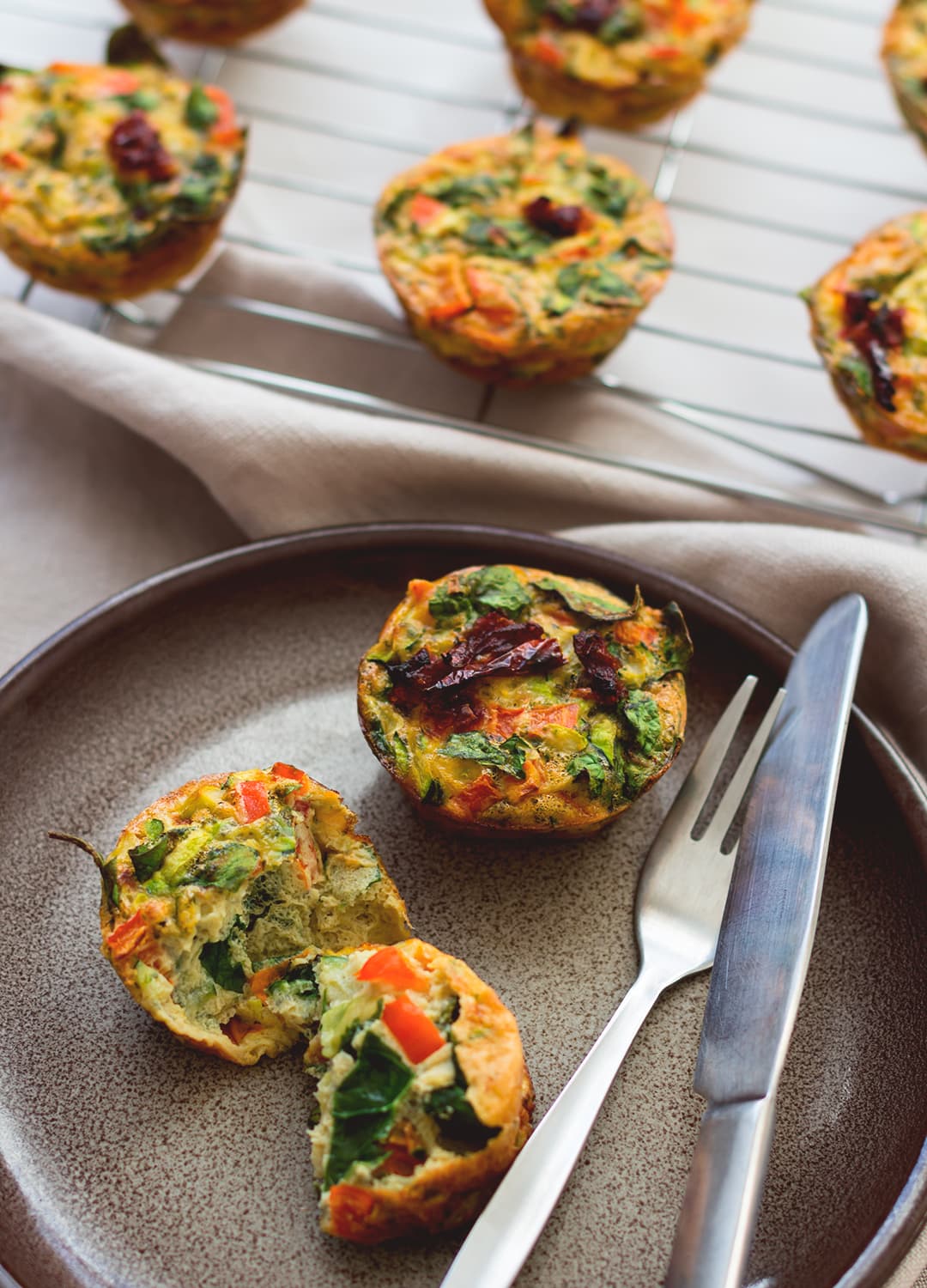 Healthy Breakfast Cheesy Egg Muffins - easy breakfast you can make ahead and eat on the go! Keep them in the fridge and add one or two to your salad for more protein! Delicious and cheesy muffins without the use of cheese - these are dairy free! | thehealthfulideas.com