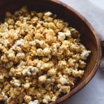 Cheesy Vegan Popcorn - a delicious healthy twist on the classic. Popped the old-fashioned way on the stove with coconut oil and then spiced to perfecting. Ridiculously easy to make! | thehealthfulideas.com