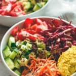 Black Rice Salad Bowl with Tahini Dressing - easy to make fresh summer salad. I love to make this ahead for busy work days! Tomatoes, cucumber, beets, carrots, hummus, lettuce, black rice, and tahini dressing. (vegan, GF) | thehealthfulideas.com