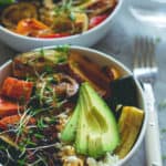 Brown Rice Salad Bowl with Roasted Veggies & Tamari Dressing - not your average boring salad! Roasted veggies, sweet potatoes, brown rice, lettuce, sundried tomatoes, goats cheese, and avocado with sweet & sour tamari dressing. Easy to make and absolutely scrumptious! | thehealthfulideas.com