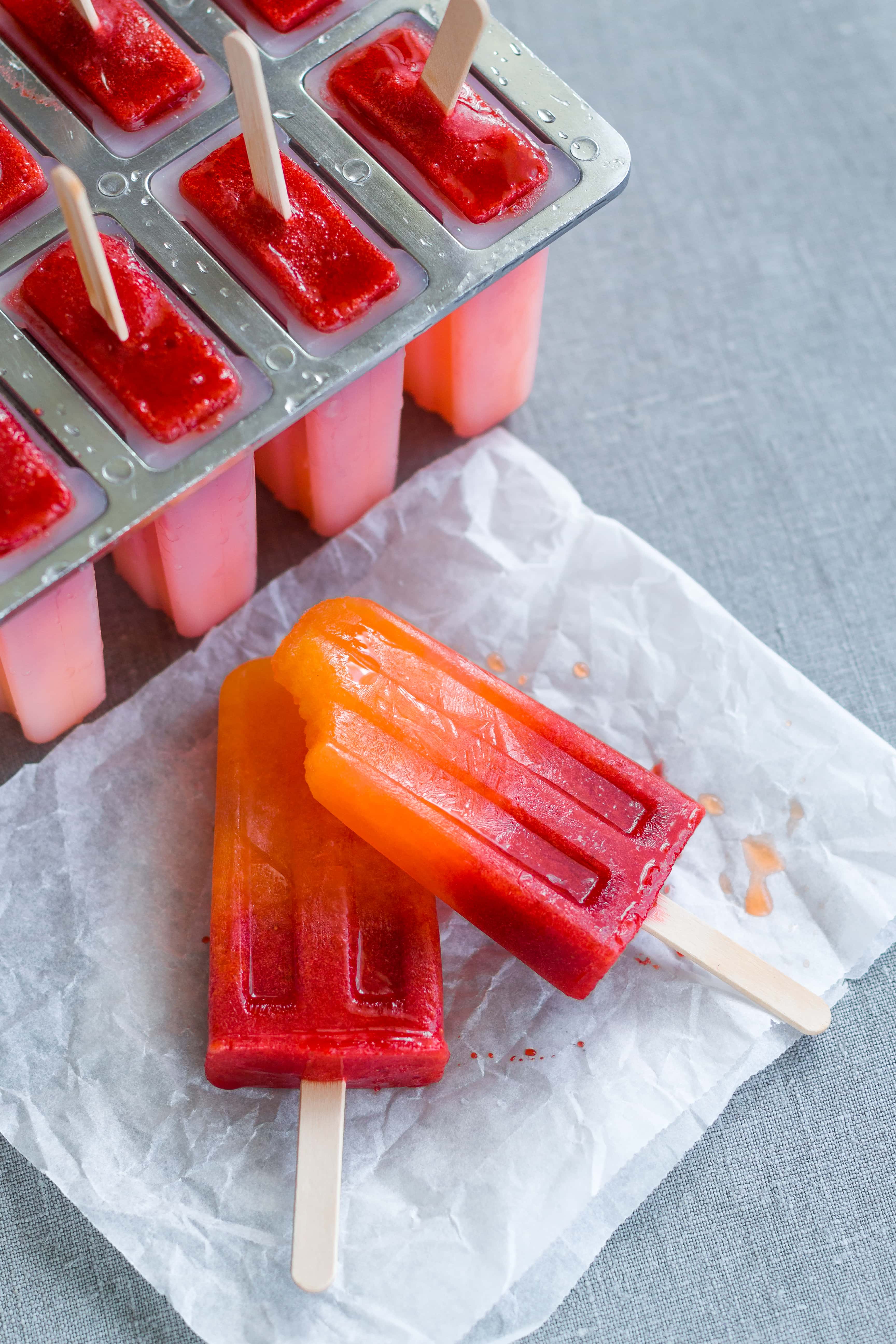 Orange Strawberry Sunrise Popsicles - treat yourself with homemade popsicles this summer. We LOVE these! They're easy to make, delicious, and actually healthy! (raw vegan) | thehealthfulideas.com