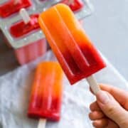 Orange Strawberry Sunrise Popsicles - treat yourself with homemade popsicles this summer. We LOVE these! They're easy to make, delicious, and actually healthy! (raw vegan) | thehealthfulideas.com