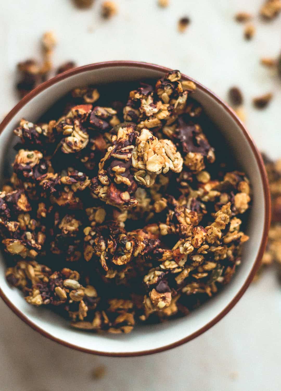 Orange Zest Granola with Dark Chocolate - delicious sweet zesty granola with melted cacao paste on top to create the best dark chocolate & orange flavor. Gluten-free, vegan, and sugar-free! You'll LOVE this granola! | thehealthfulideas.com