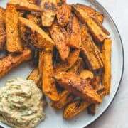 Tandoori Masala Sweet Potato Wedges (vegan, GF) - over roasted sweet potato fries with amazing spices, and a touch of coconut oil. Easy to make, delicious, and totally guilt-free. You'll love this recipe! | thehealthfulideas.com