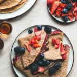 Chickpea Flour Crepes with Tahini Chocolate Sauce and Strawberry Chia Jam (vegan, gluten-free) - you won't believe these are actually vegan! SO delicious, fluffy, soft, and sweet. Brunch staple and my absolute favorite crepe recipe! | thehealthfulideas.com