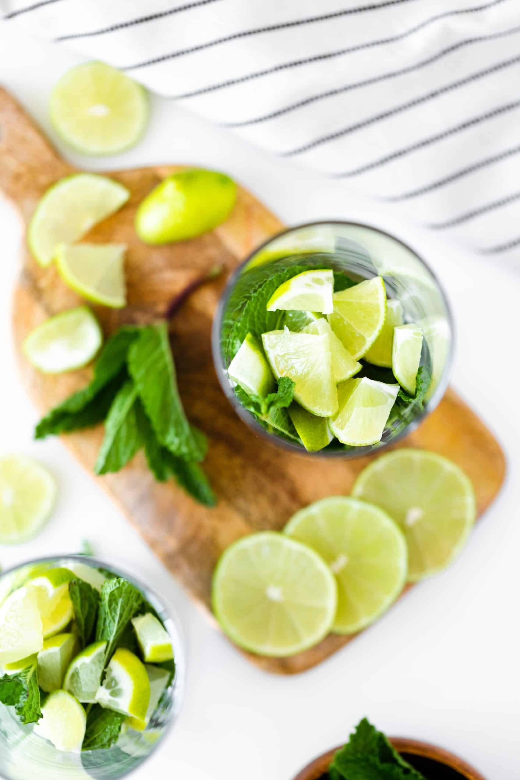 Ingredients for a mojito in a tall glass. Overhead photo