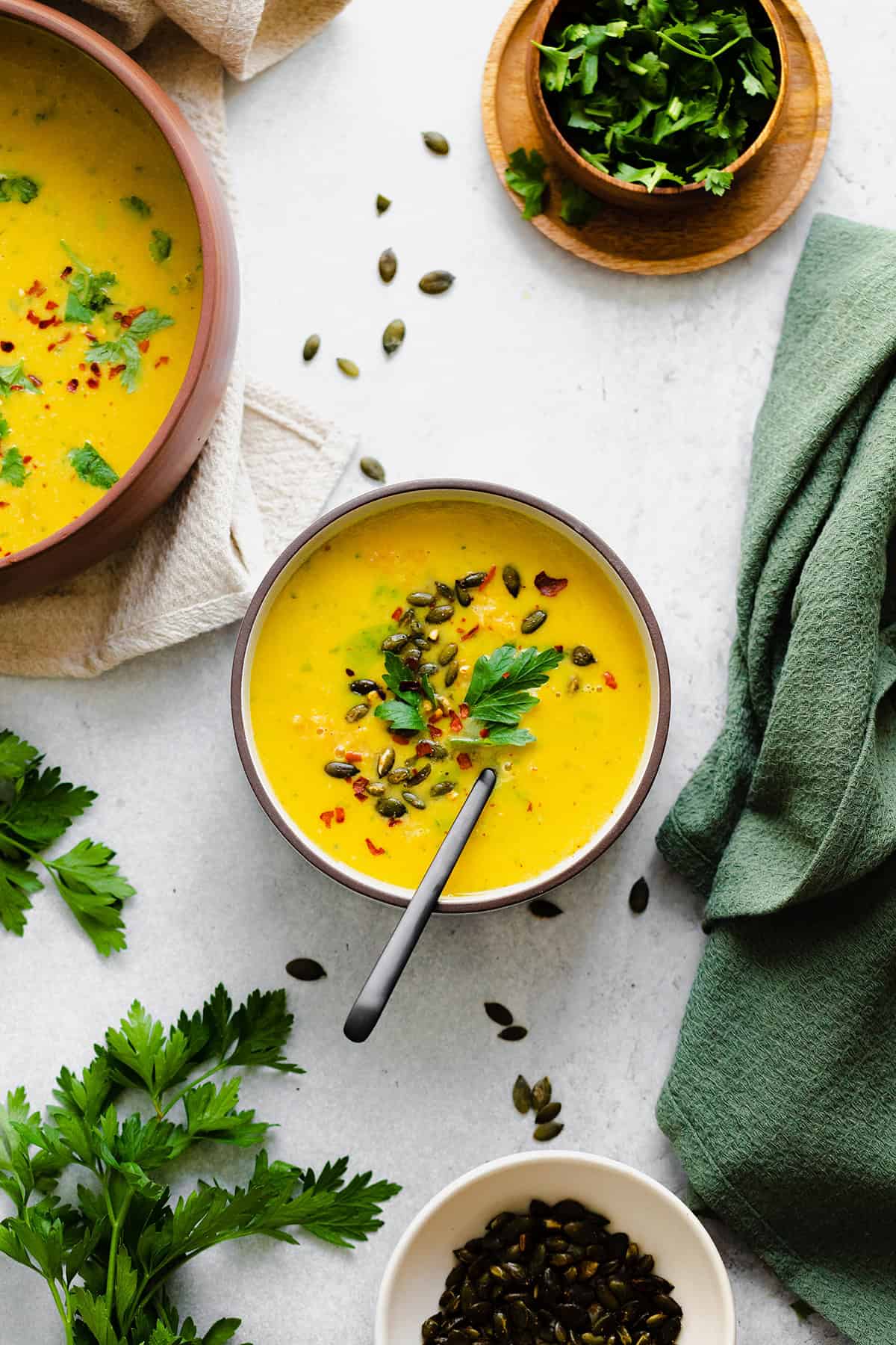 Butternut Squash Curry Soup with Red Lentils in a bowl on a white background