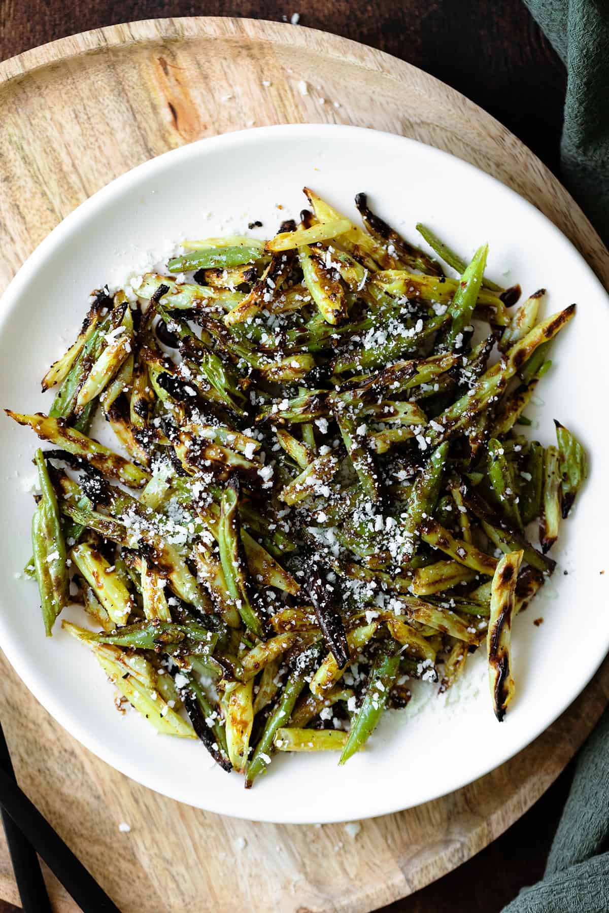 Overhead close up shot of Charred Green Beans with Pecorino Cheese