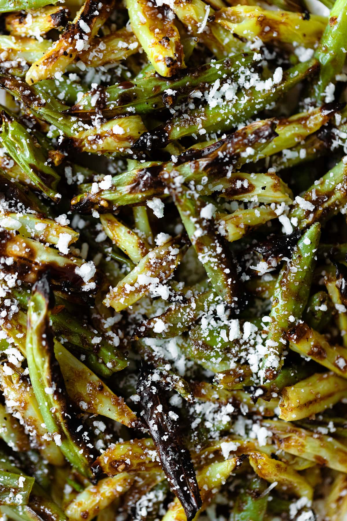 Overhead close up shot of Charred Green Beans with Pecorino Cheese