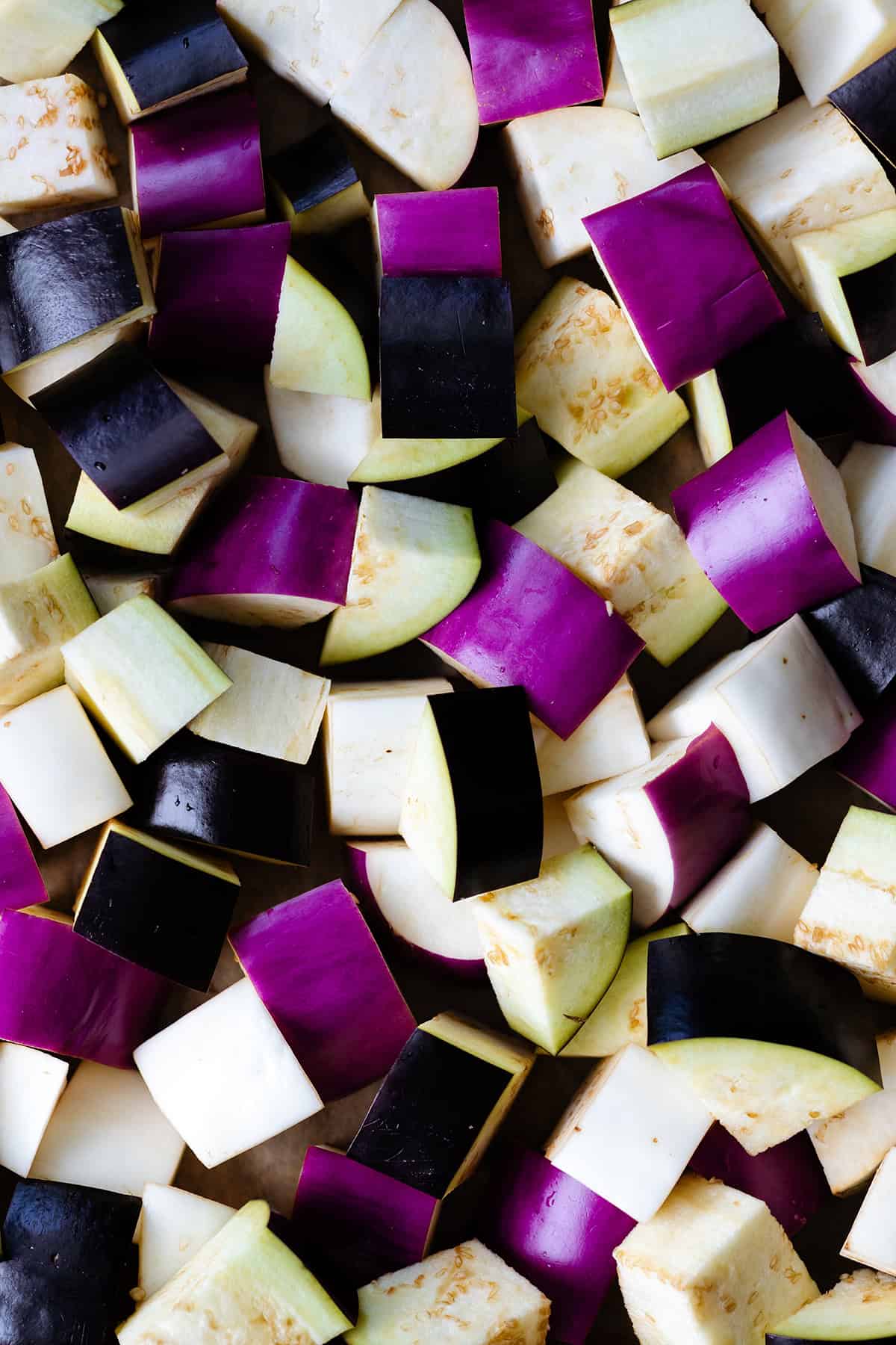 Diced eggplant (three different colors - dark purple, light purple, and white)