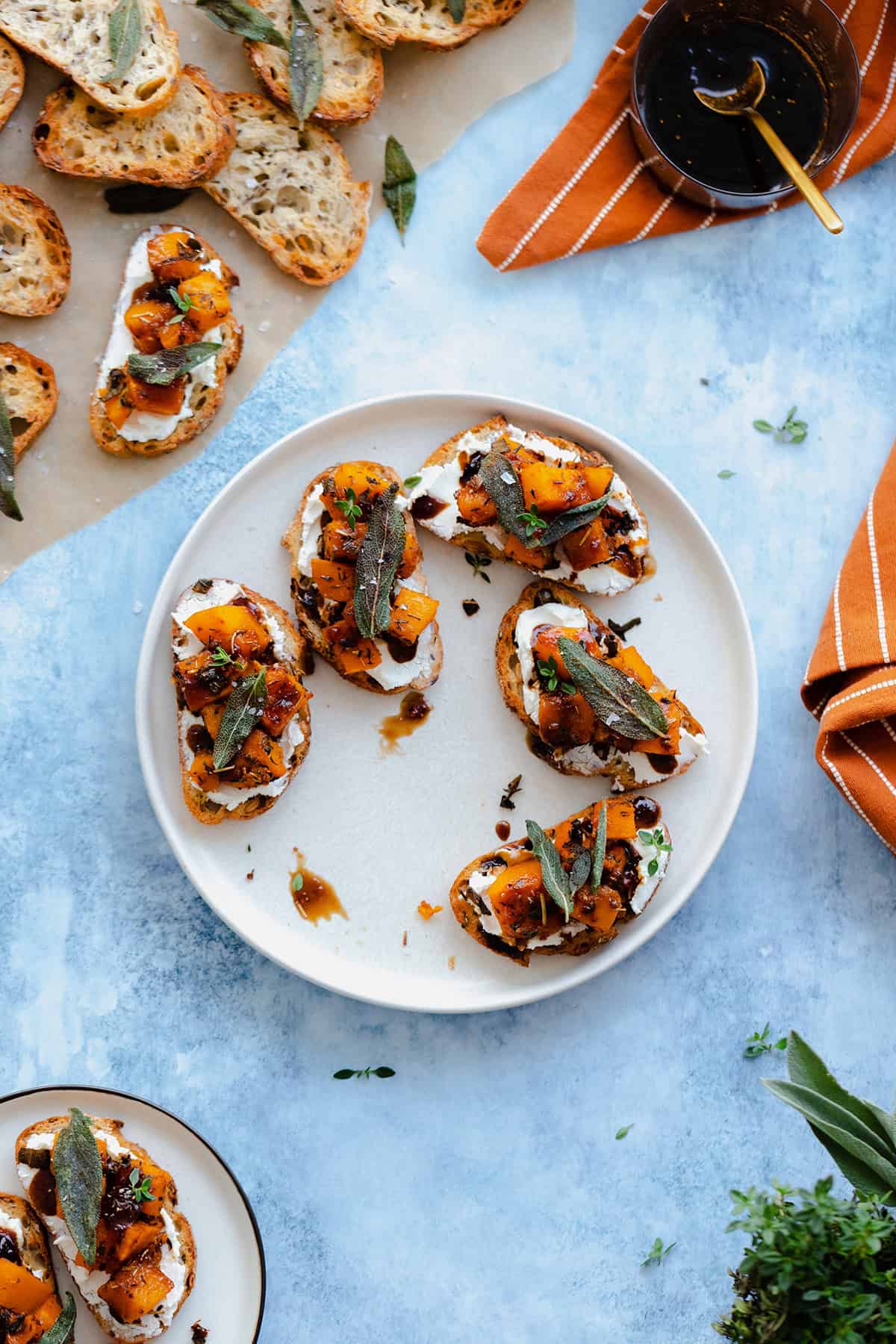 An overheat shot of Butternut Squash Crostini with Goat Cheese and Fig Balsamic Glaze