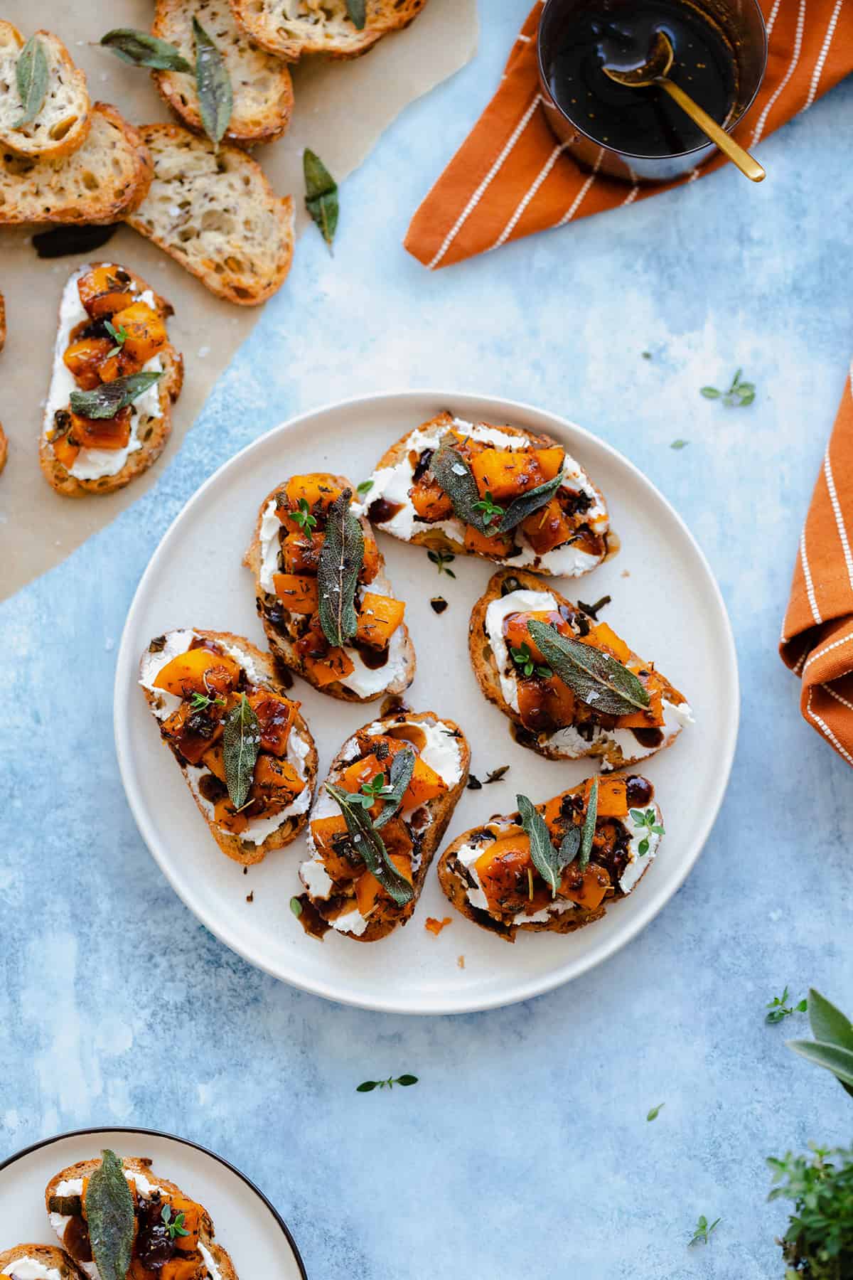 An overhead shot of Butternut Squash Crostini with Goat Cheese and Fig Balsamic Glaze