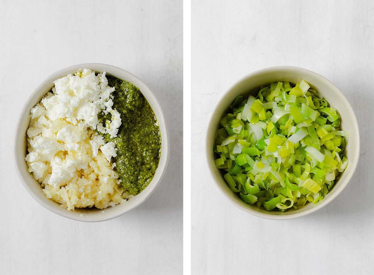 Goat cheese, garlic, and pesto in a bowl on the left, and a bowl of sauteed chopped leek on the right.