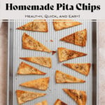 Homemade pita chips on a silver baking sheet.