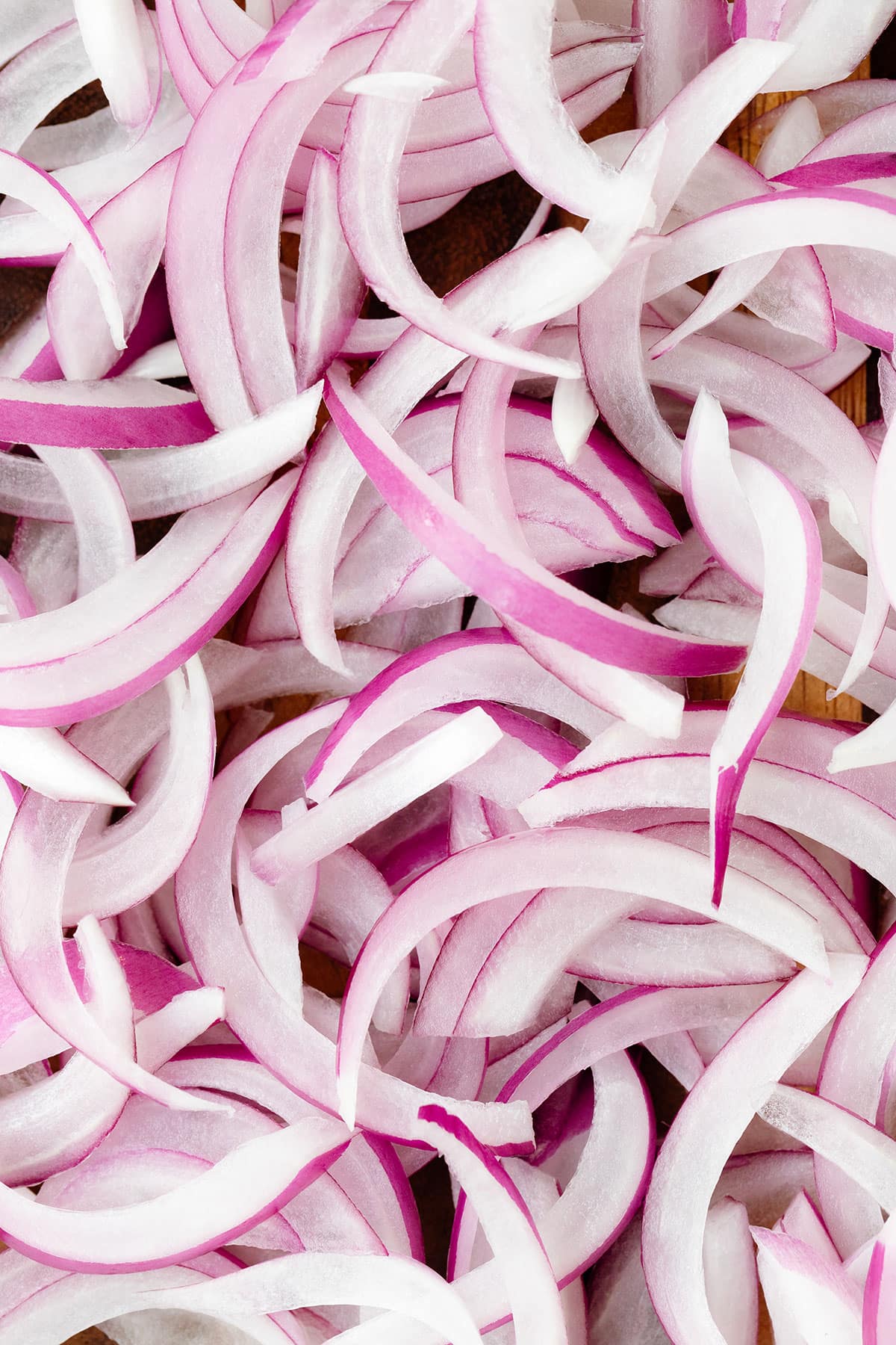 A close up photo of sliced red onion