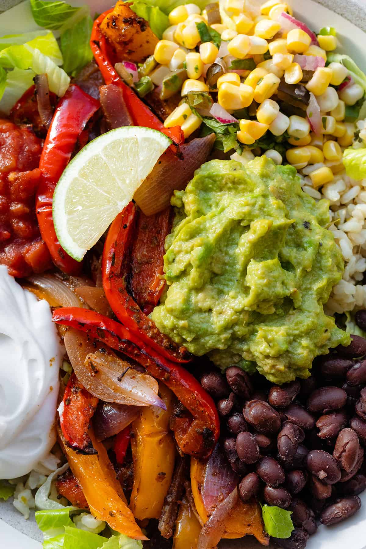 A close up of plated veggie burrito bowl.