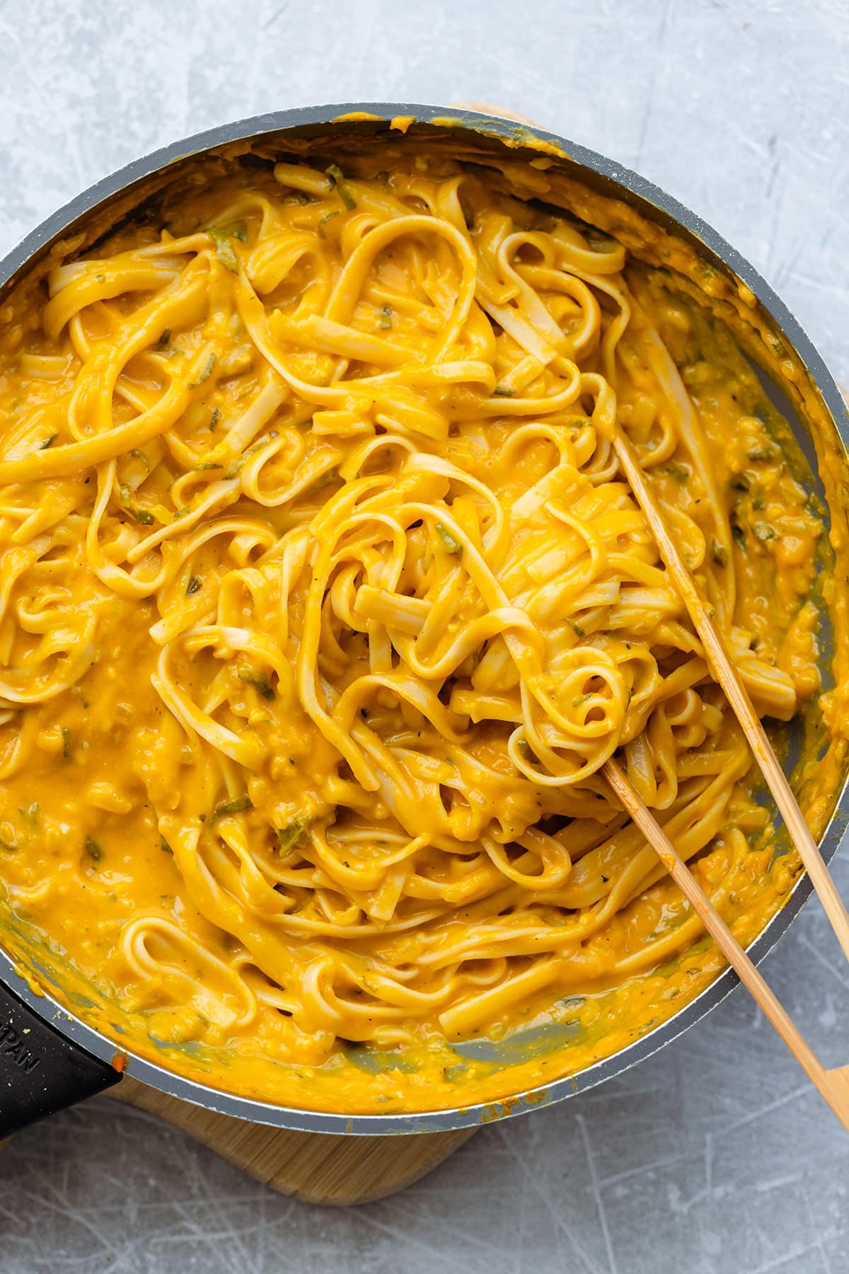 Creamy pumpkin pasta in a pan ready to be served.