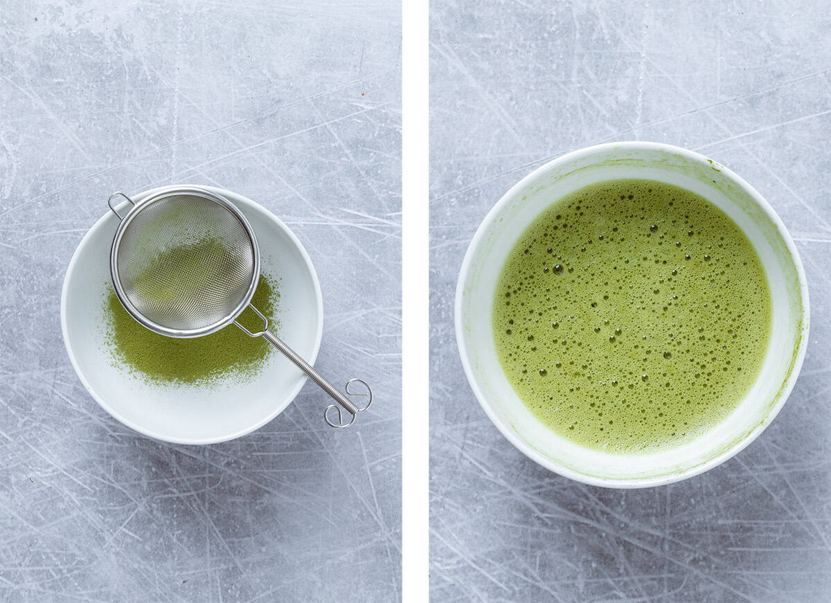 Matcha being sifted into a white bowl and whisked with water.