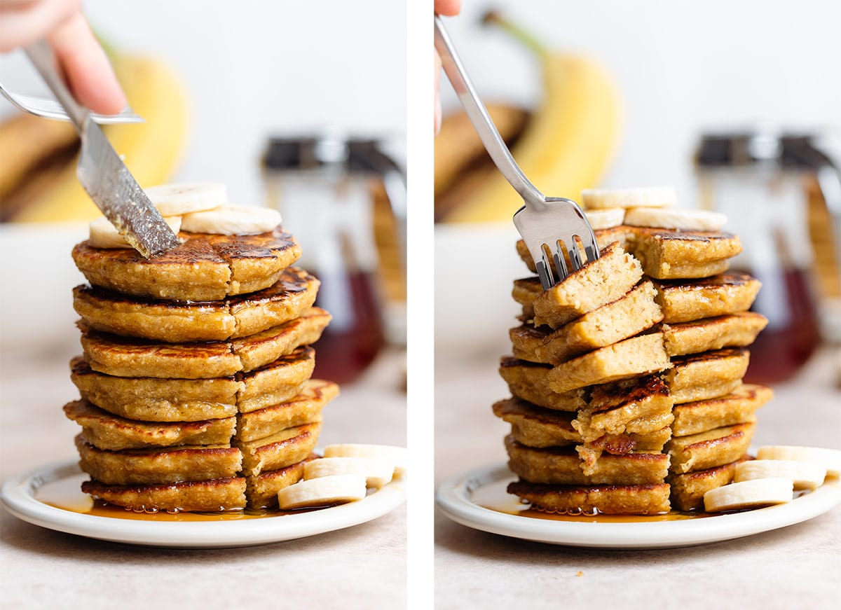 A knife cutting into a pancake stack and a fork picking up the slices and showing the inside of the pancakes.