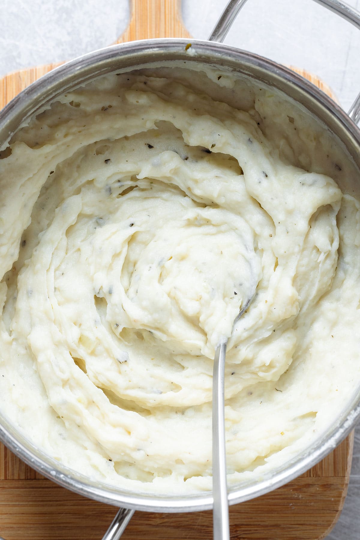 Creamy mashed potatoes with finely chopped fresh rosemary stirred into it.