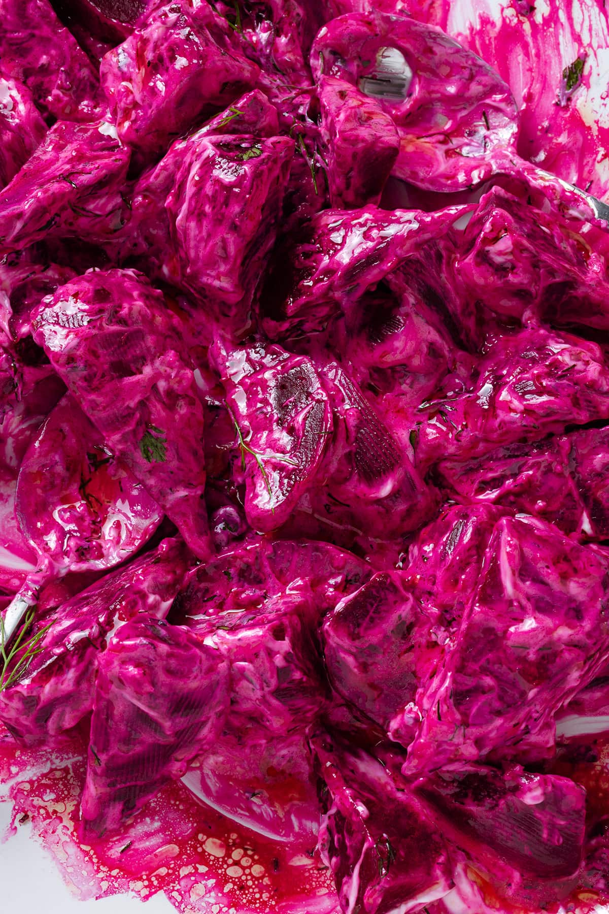 Bright pink beet salad with lemon vinaigrette and greek yogurt mixed with the beets.