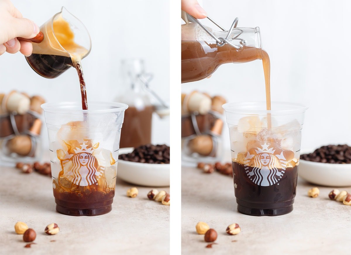 Coffee and hazelnut syrup being poured into a plastic Starbucks cup over ice.