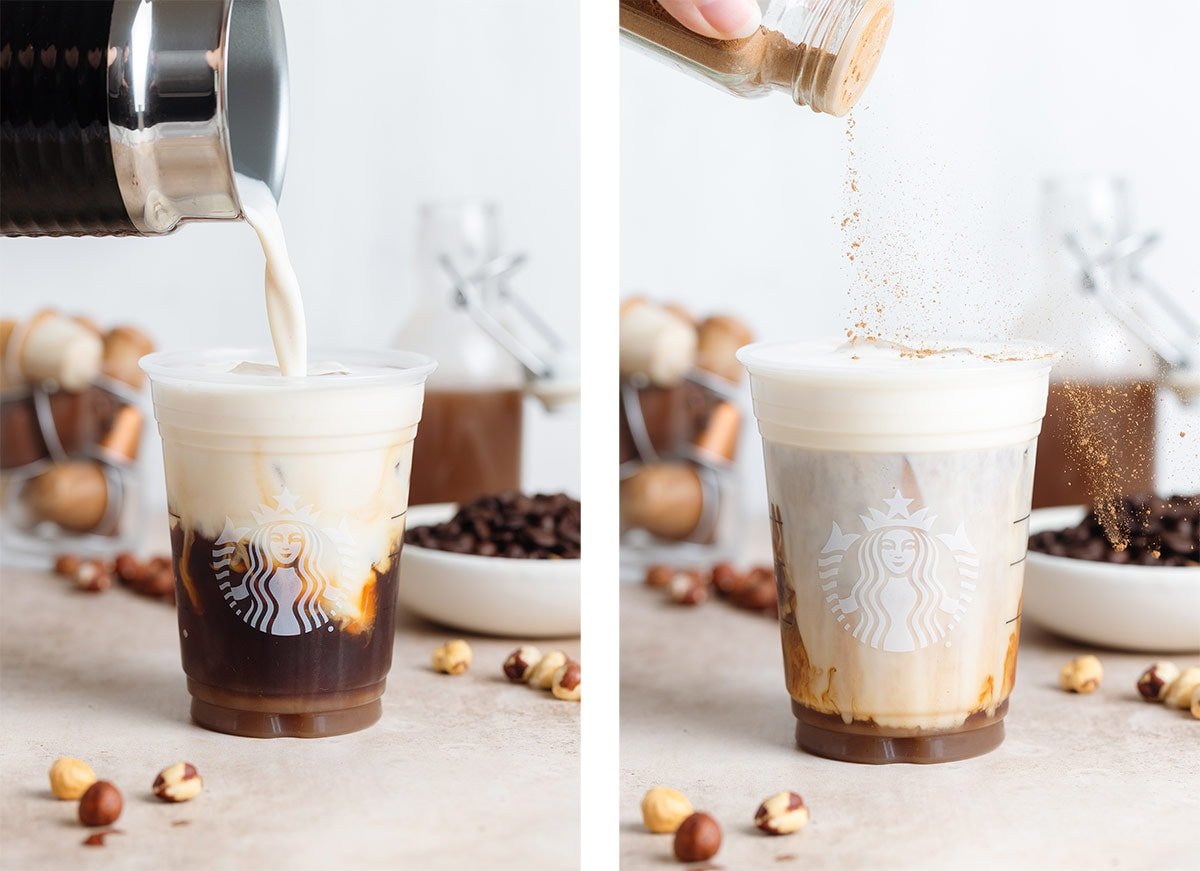 Milk being poured over ice with coffee in a plastic cup and cinnamon being sprinkled on top.