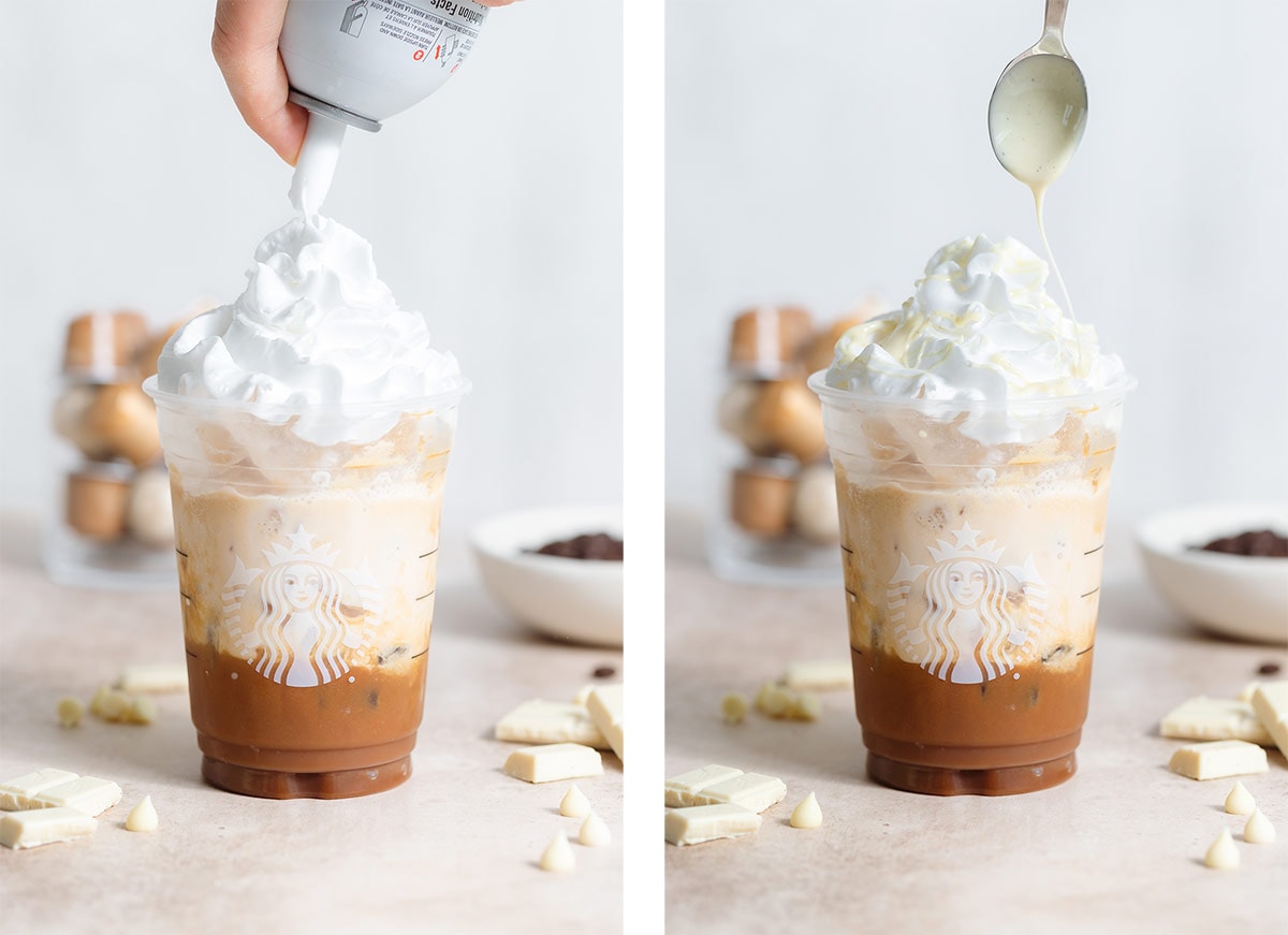 A starbucks cup with white chocolate mocha being garnished with whipped cream and melted white chocolate.
