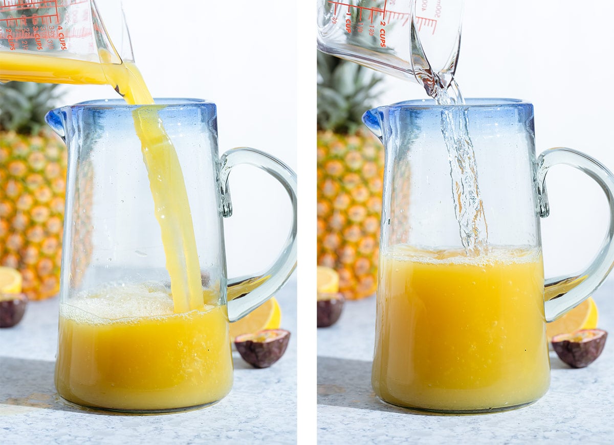 Pineapple juice and water being poured into a tall pitcher with a blue rim.