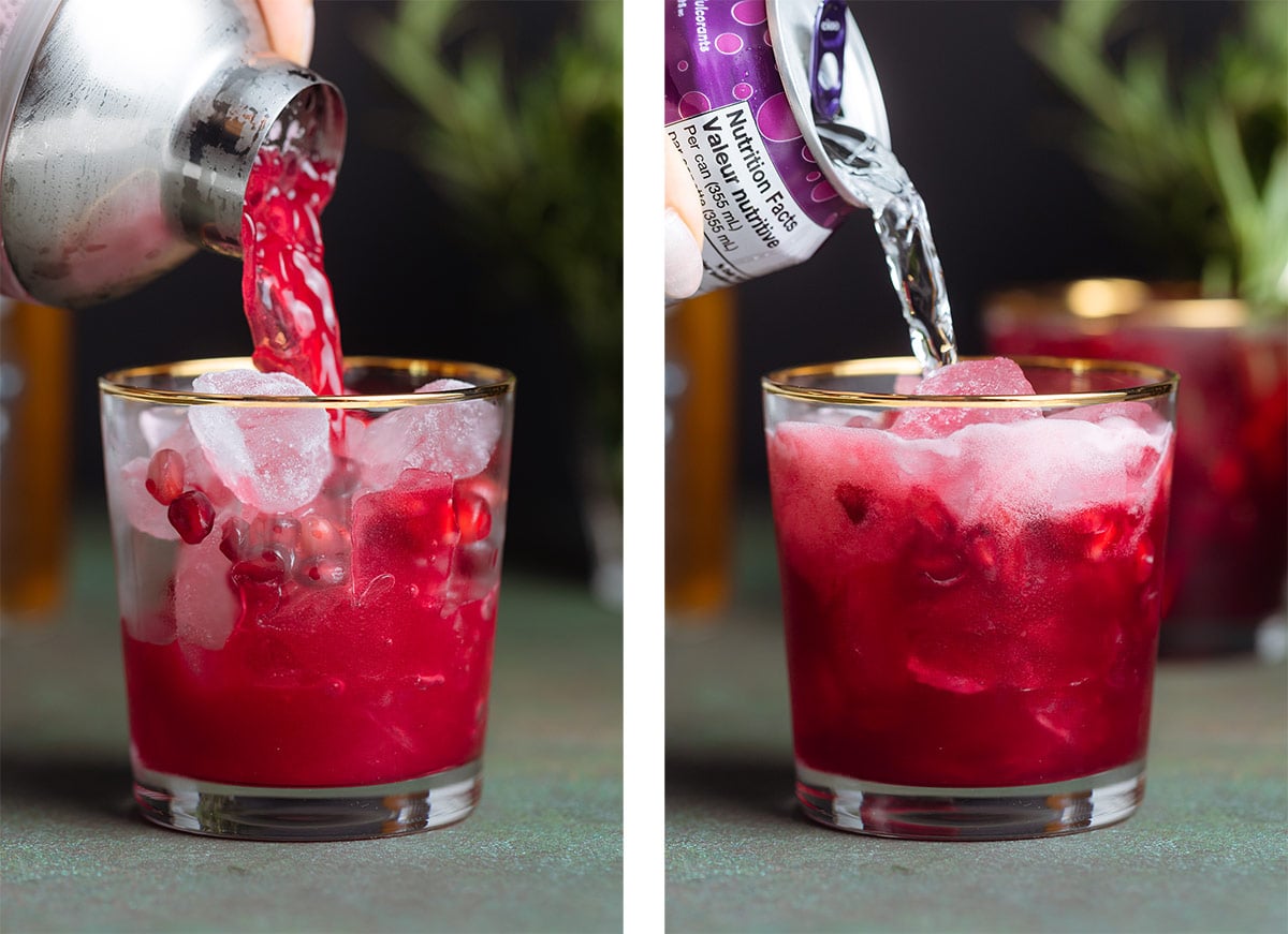 Bright red pomegranate mocktail being strained over ice into a glass with a gold rim and being topped with seltzer.